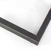 This simple, flat faced frame features rustic wood lightly coated in charcoal grey/black paint.  The top coat is rubbed away in places to reveal the natural wood color below, for a soft, antiqued look.

3/4 " wide: ideal for small and medium-size images.  Whether photography or paintings, rural scenes and simple images will look striking in this frame.
