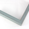 This simple, flat faced frame features rustic wood with a light wash. The natural grain and wood color shows through the sanded, grey-blue varnish, giving the frame a soft, antiqued appearance.

3/4 " wide: ideal for small and medium images.  Whether photography or paintings, rural scenes and simple images will look striking in this frame.