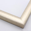This high shine, silver foil frame features a thick curved profile.  A brushed finish reveals subtle lines and faint black spattering gives an antique look - simple, yet glamorous. A 1 " rabbet gives this frame a shadow-box quality.

1.25 "es width: ideal for medium-sized images.  Select an oil or watercolour painting, print, or abstract photograph.