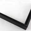 Slim 5/16 " metal frame. This frame comes in solid mars black. The face has a frosted texture and reflects dispersed light. The profile features a horizontal brushed texture.

Nielsen n22-21 Profile