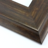 This large, scoop profile frame features a steep ridge that slopes gently toward the artwork, and steeply away.  The bronzed walnut wash highlights the natural wood grain with glossy golds and matte browns.

3.5 " width: ideal for oversize images. The elegant simplicity of this frame makes it suitable for a wide variety of photographs, paintings and giclee prints.