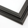 This solid wood, matte black frame features a reverse scoop profile.  The inner lip recedes in a series of curved steps into a steep dip and a raised outer edge. 

1.75 " width: ideal for medium size images.  A wide variety of photographs, paintings and prints will be enhanced within this unique frame.