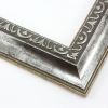 This classic, Victorian-style frame features a solid wood, reverse scoop profile.  The relief-detailed inner lip and sloped face are a textured silver foil, edged in a subtle bevel.

2 " width: ideal for medium size images. Border an acrylic or oil painting or print with this antiqued, high fashion frame.