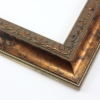 This classic, Victorian-style frame features a solid wood, reverse scoop profile.  The relief-detailed inner lip and sloped face are a mottled bronze foil, edged in a subtle bevel.

2 " width: ideal for medium size images. Border an acrylic or oil painting or print with this antiqued, high fashion frame.
