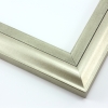 This high shine, silver foil wood frame features an elegant curve-and-scoop profile that draws the eye inward.  Slight distressing on the inner lip, and dark grey along the stepped ridge add a subtle antique finish.

1.75 " width: suitable for both medium and large images.  A striking border for a black and white photograph, or to highlight a classic painting or Giclée print.