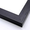This heavy frame features simple, straight edges and a glossy black finish with wood grain details. 

Protruding 1.25 "es, a distinct division is achieved between art and wall. The deep rabbet also provides shadow box properties.

1.5 " width: ideal for medium size images.  The simple, classic nature of this frame, and it